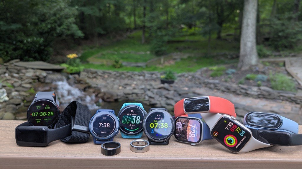 Modern fitness tracker displayed on a desk with running gear for an article about best trackers.