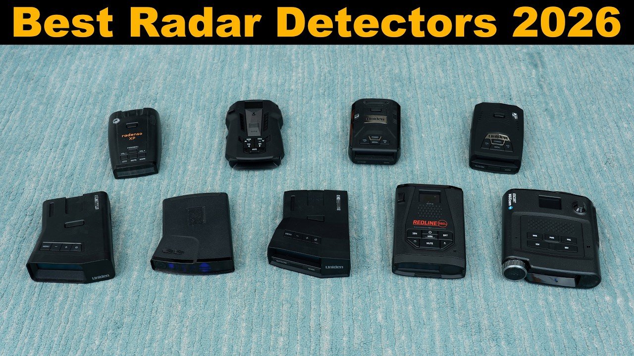 A modern radar detector sits on a dashboard overlooking a scenic road trip.